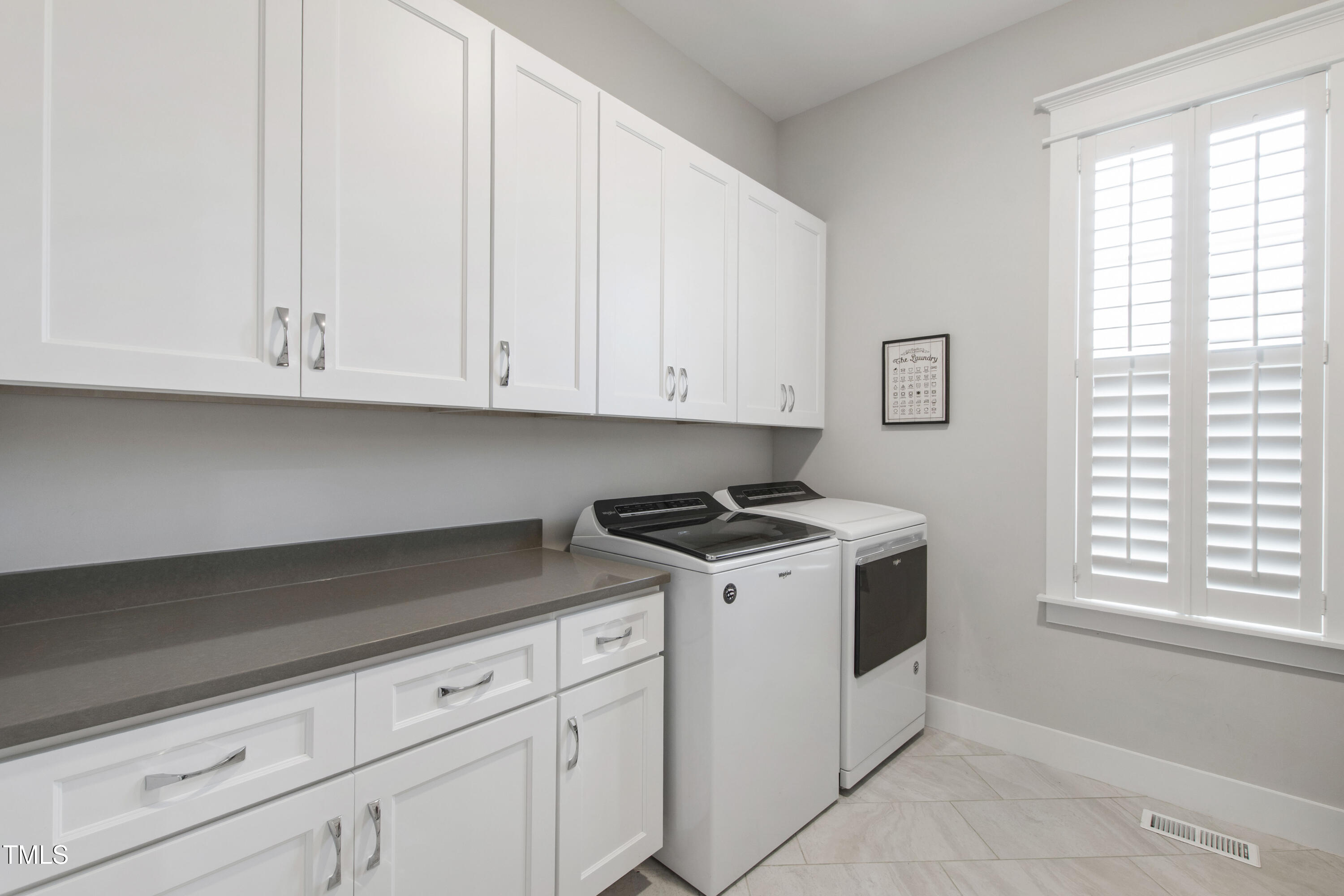 713 Brownwich Street Wake Forest, NC 27587 - Photo 57 of 78 a kitchen with white cabinets and white appliances