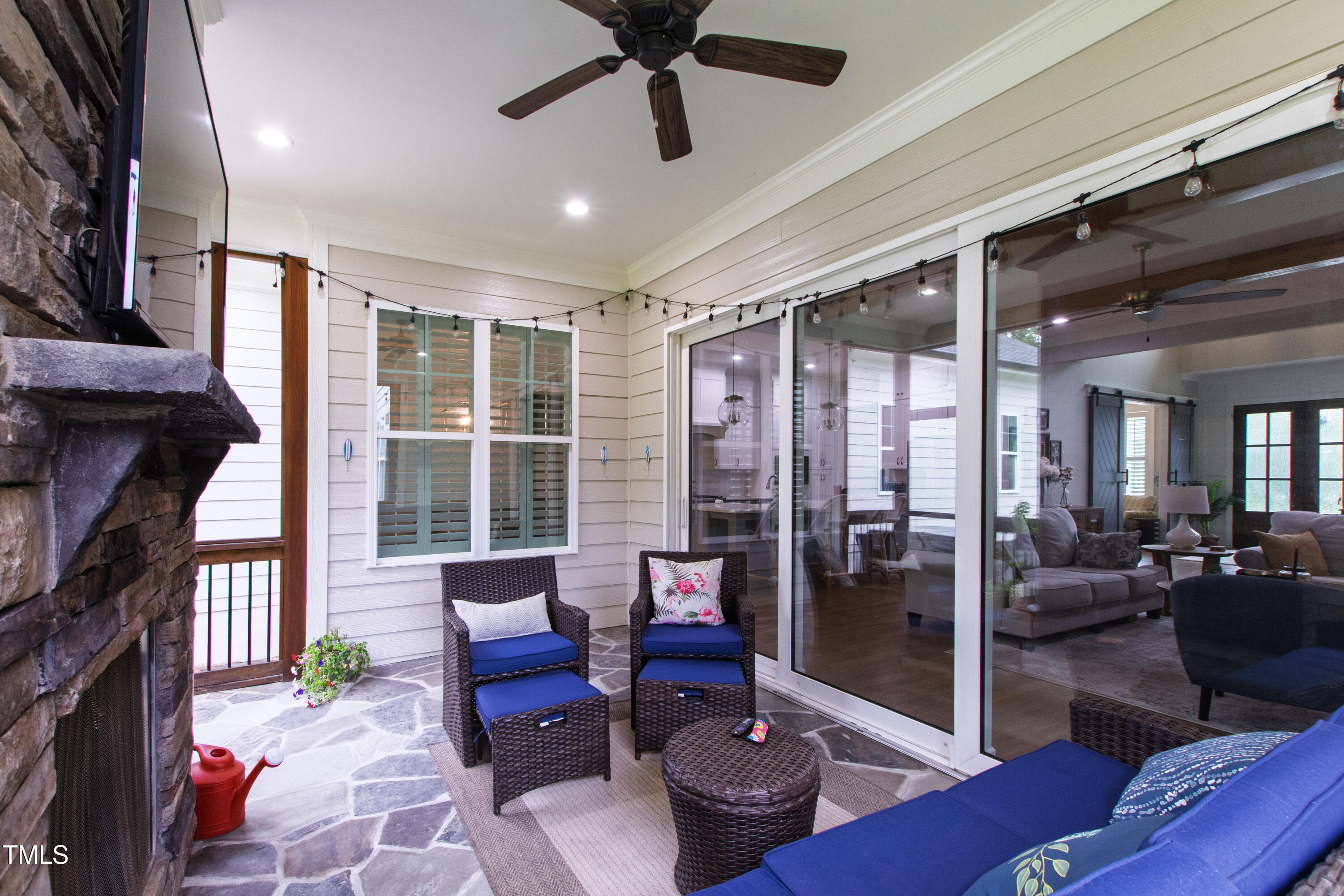 713 Brownwich Street Wake Forest, NC 27587 - Photo 61 of 78 a living room with furniture and a floor to ceiling window