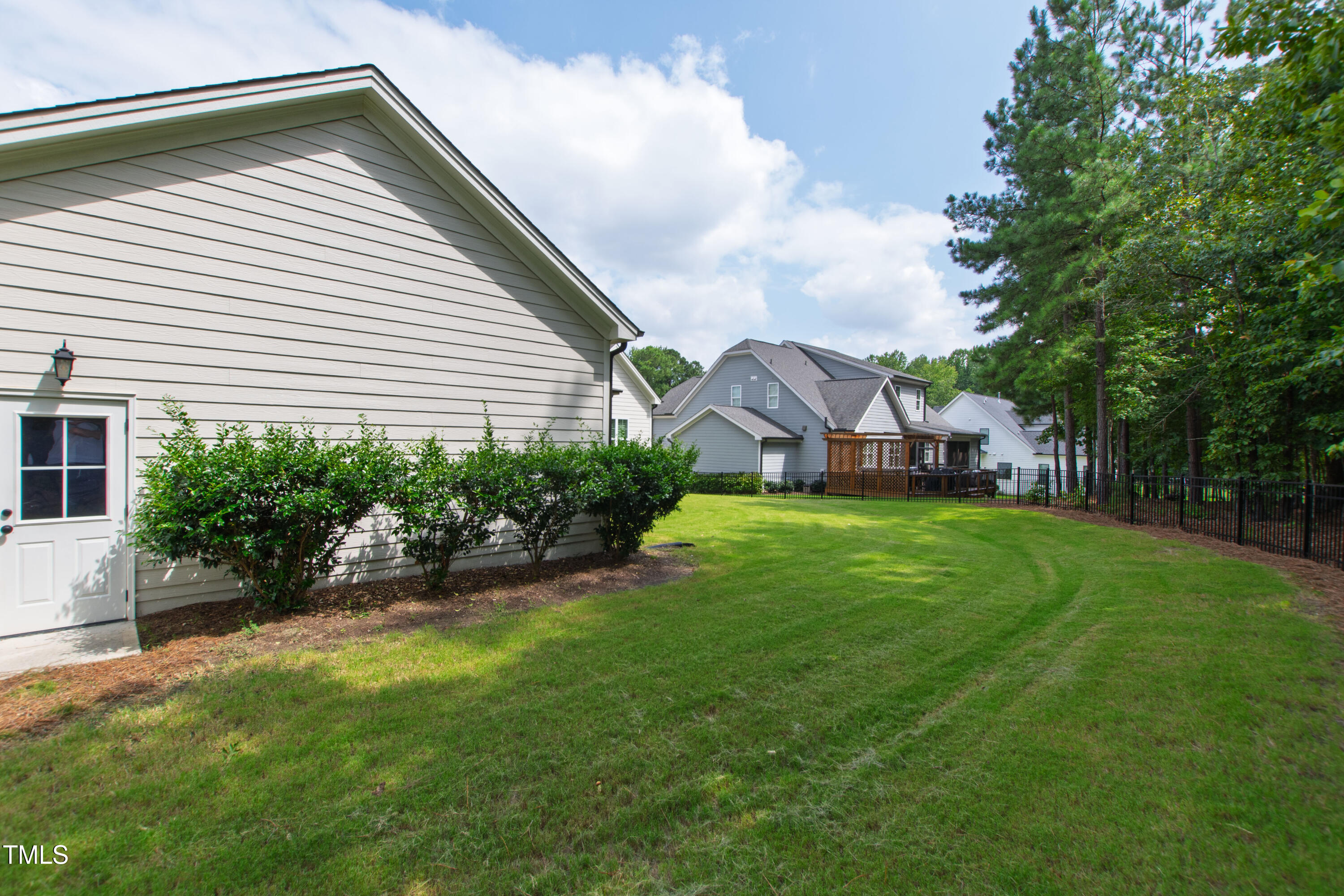 713 Brownwich Street Wake Forest, NC 27587 - Photo 65 of 78 a view of a house with a backyard