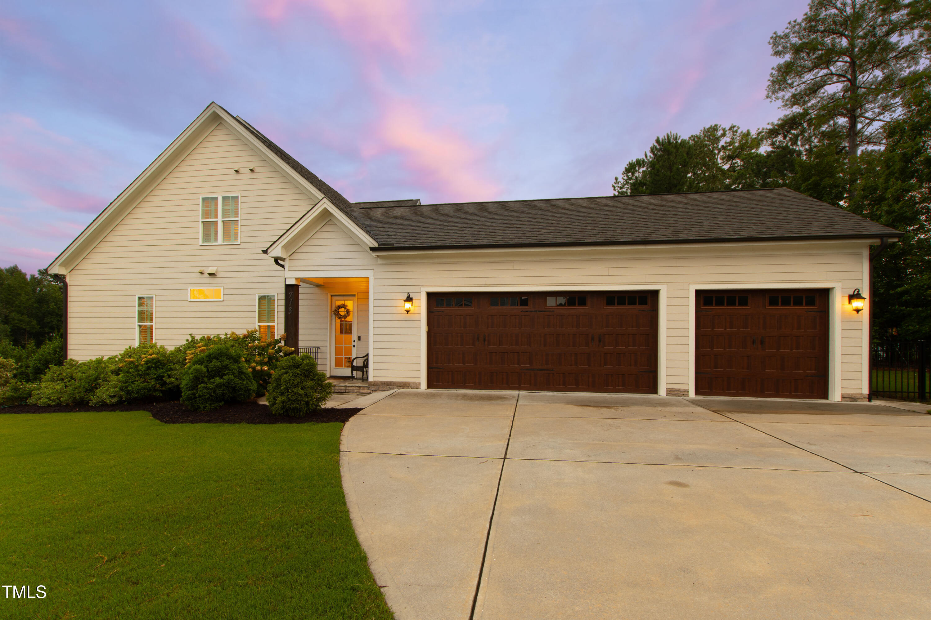 713 Brownwich Street Wake Forest, NC 27587 - Photo 72 of 78 a front view of a house with garden