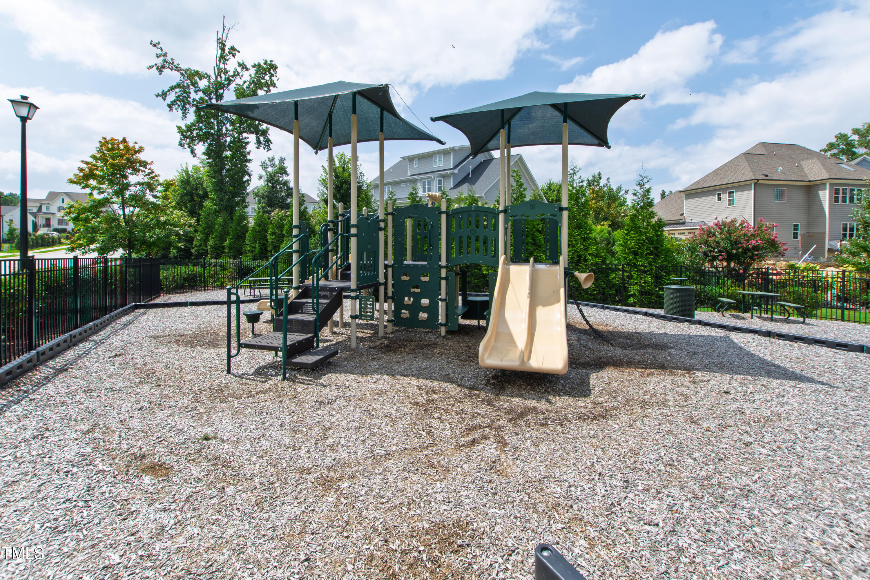 713 Brownwich Street Wake Forest, NC 27587 - Photo 74 of 78 a view of a table and chairs under an umbrella