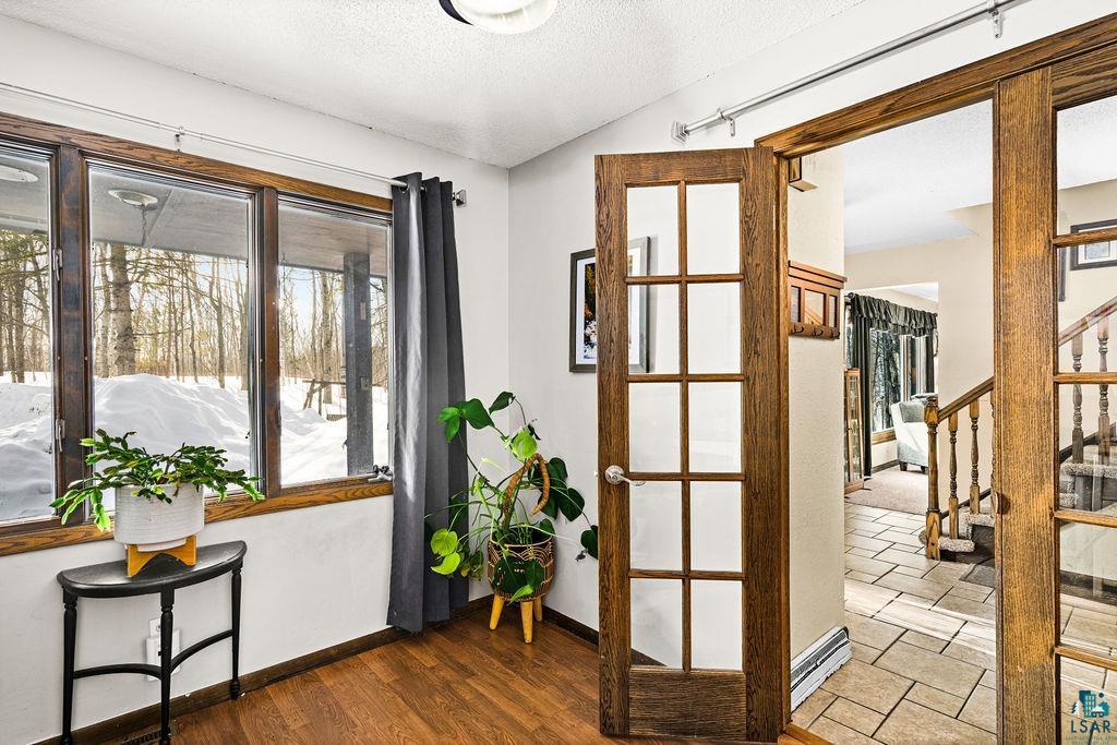 421 St Louis River Road Proctor, MN 55810 - Photo 18 of 57 Entryway with a textured ceiling and wood finished floors