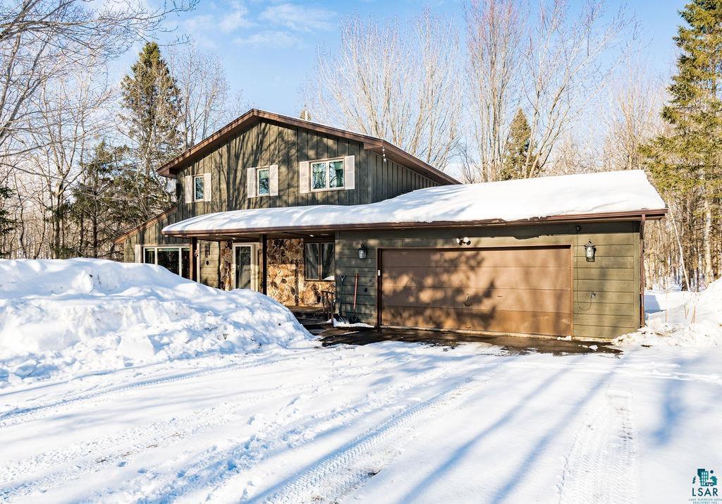 421 St Louis River Road Proctor, MN 55810 - Photo 2 of 57 Chalet / cabin with an attached garage and board and batten siding