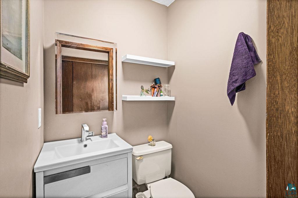 421 St Louis River Road Proctor, MN 55810 - Photo 37 of 57 Half bath with vanity and toilet