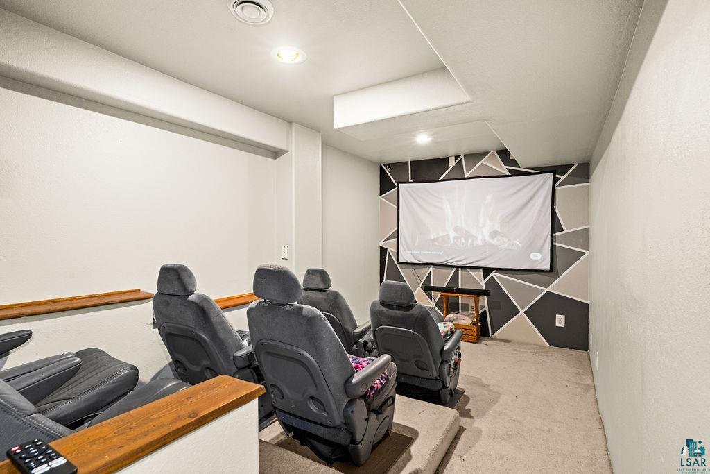 421 St Louis River Road Proctor, MN 55810 - Photo 43 of 57 Home theater room featuring unfinished concrete floors, recessed lighting, and an accent wall