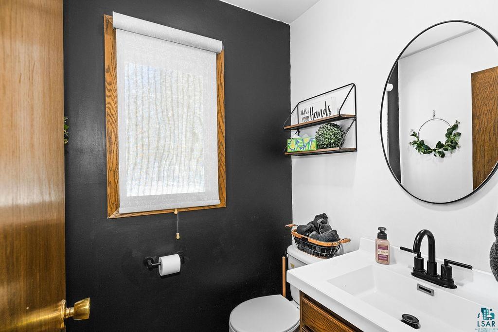 421 St Louis River Road Proctor, MN 55810 - Photo 9 of 57 Half bath featuring vanity and toilet