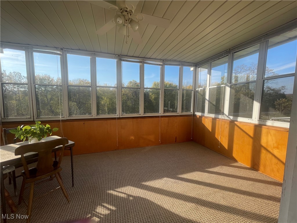 3707 River Road Vienna, WV 26105 - Photo 5 of 35 Unfurnished sunroom featuring ceiling fan