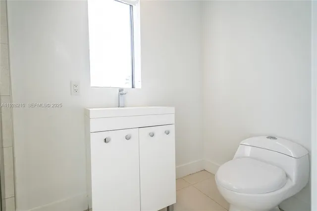 a picture of a bathroom with a shower