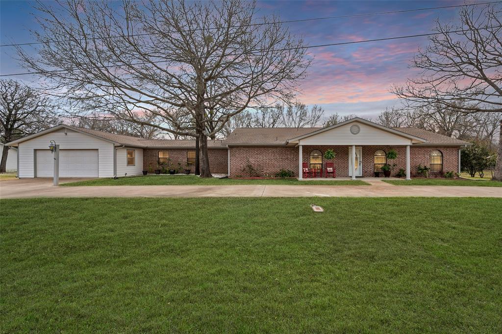 116 Walker Streetman, TX 75859 - Photo 1 of 1 a front view of a house with a garden