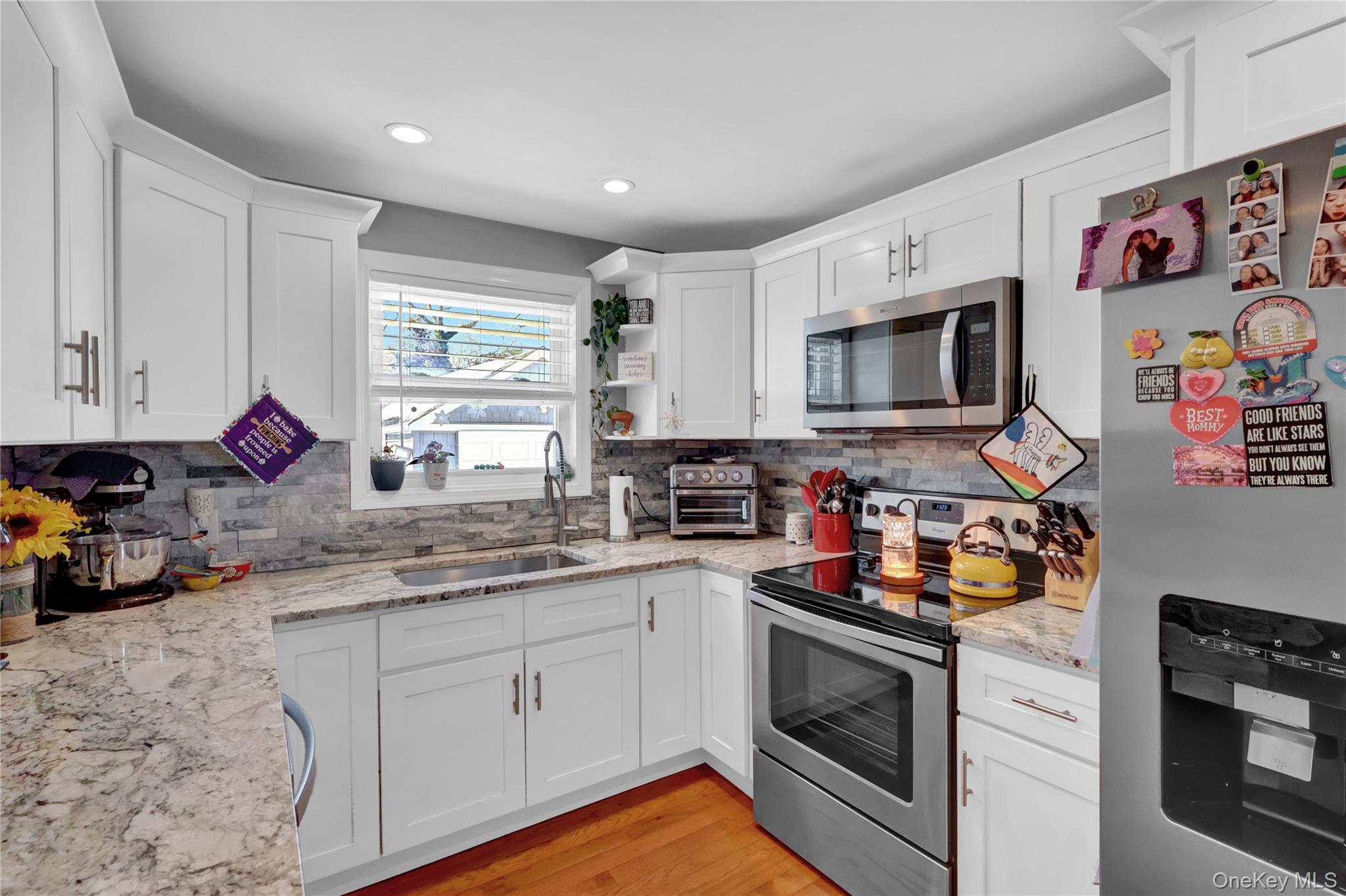 522 Browns Road Nesconset, NY 11767 - Photo 12 of 29 a kitchen with stainless steel appliances granite countertop a stove a sink and a microwave