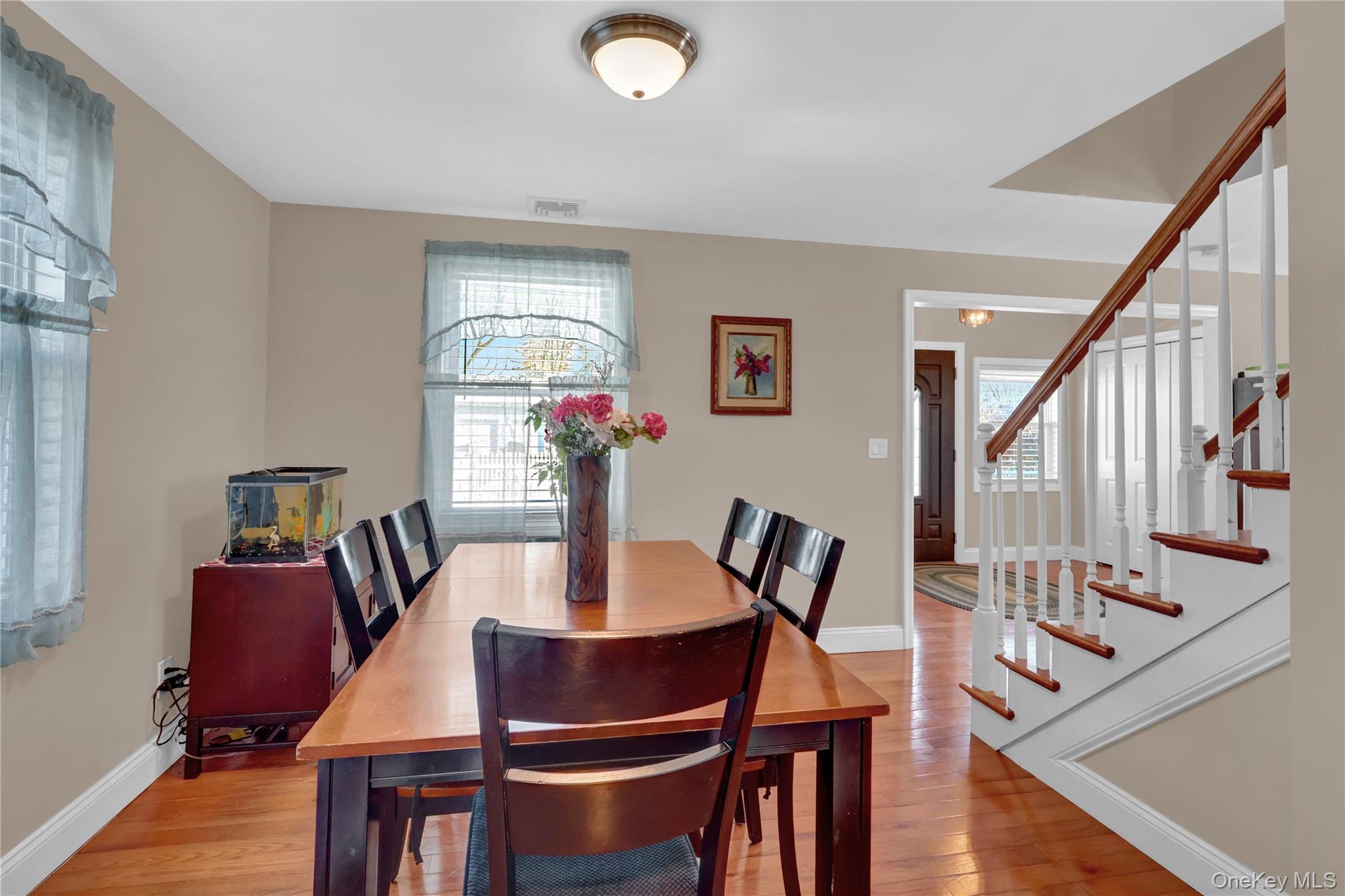 522 Browns Road Nesconset, NY 11767 - Photo 15 of 29 a view of a dining room with furniture window and wooden floor