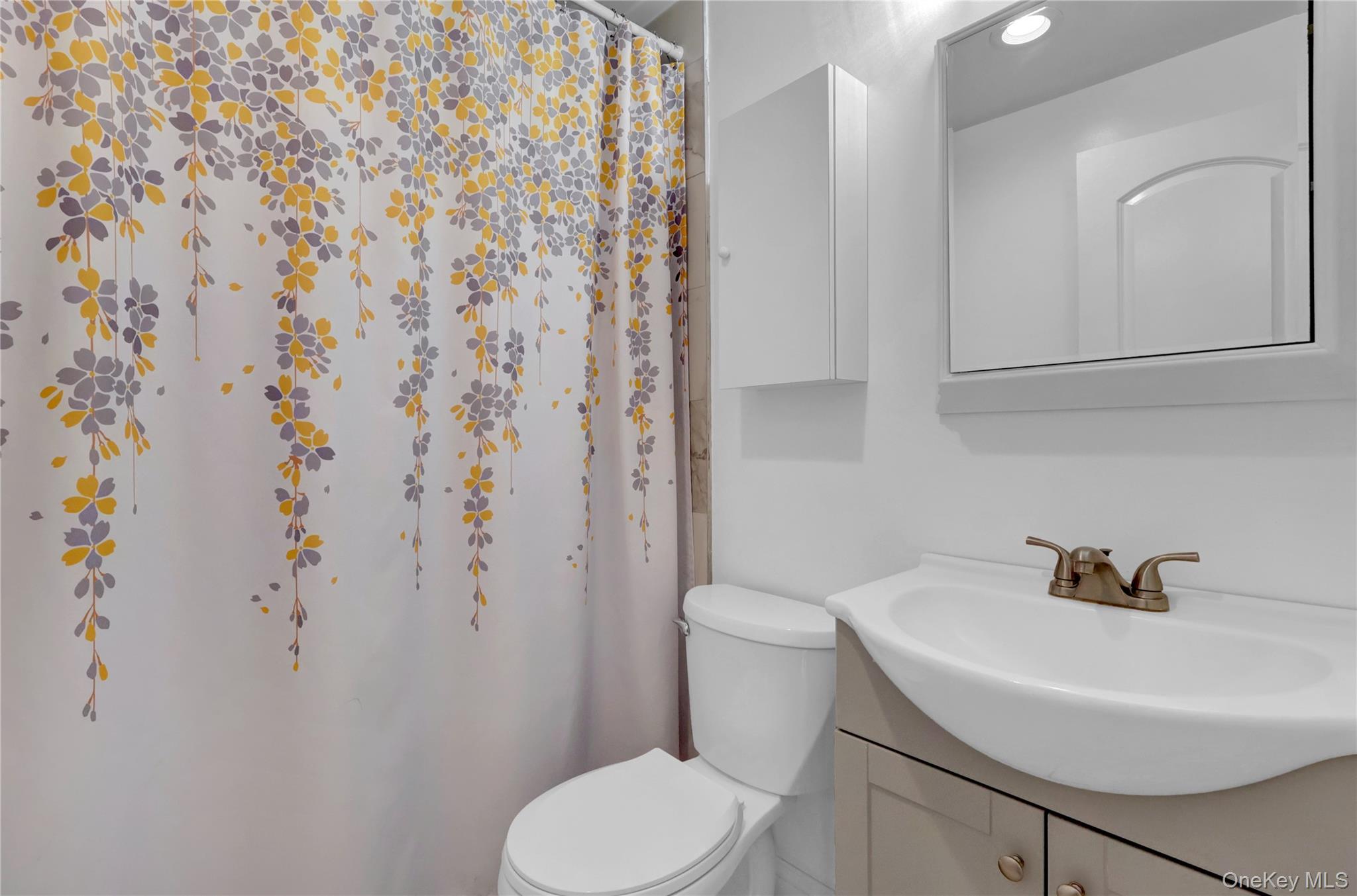 522 Browns Road Nesconset, NY 11767 - Photo 16 of 29 a white toilet sitting next to a white sink