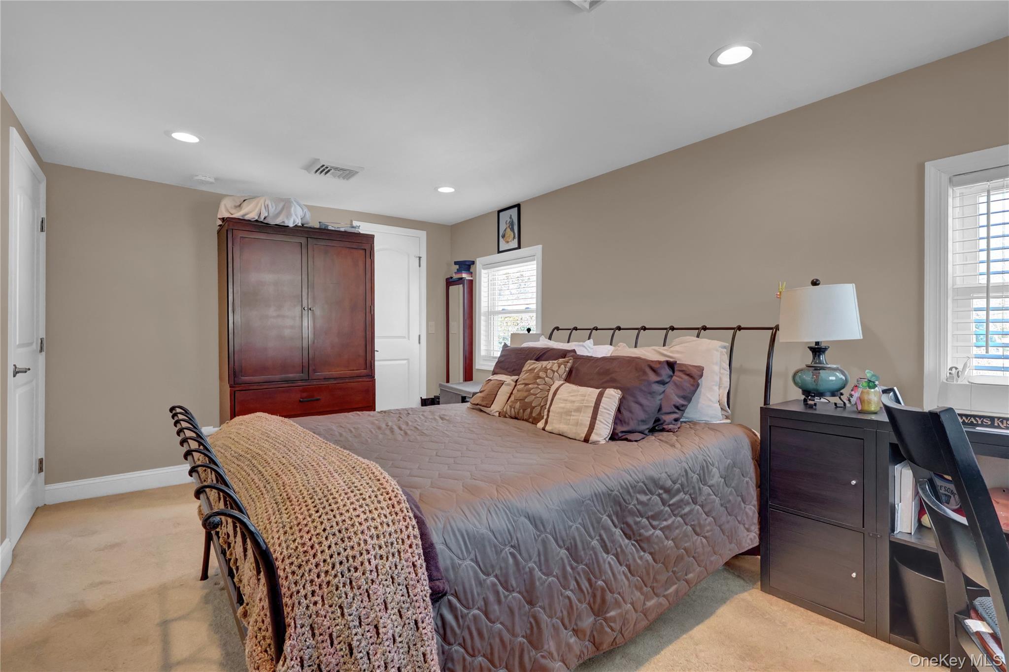 522 Browns Road Nesconset, NY 11767 - Photo 18 of 29 a bedroom with a bed and lamp