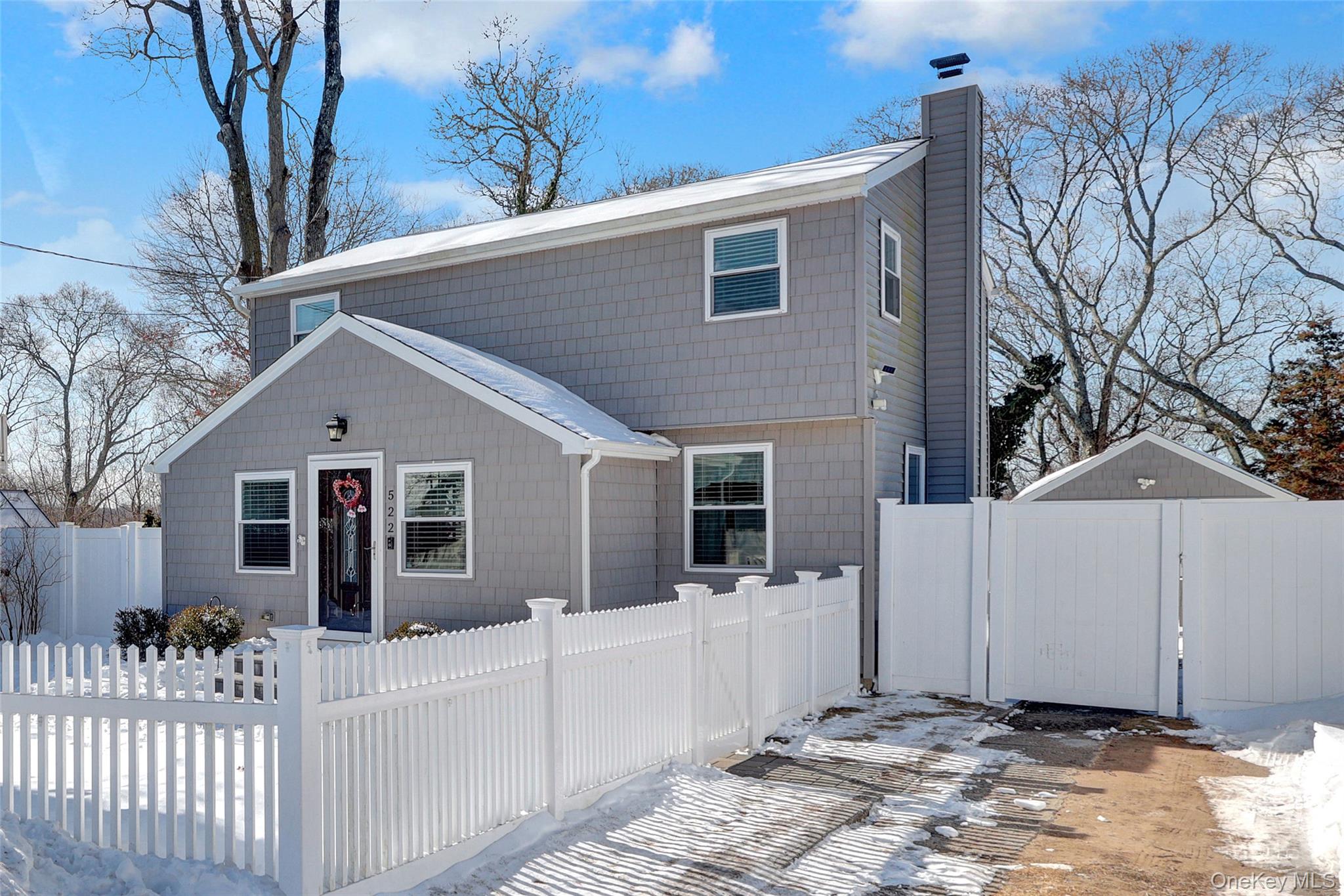 522 Browns Road Nesconset, NY 11767 - Photo 3 of 29 a view of a white house with a large windows