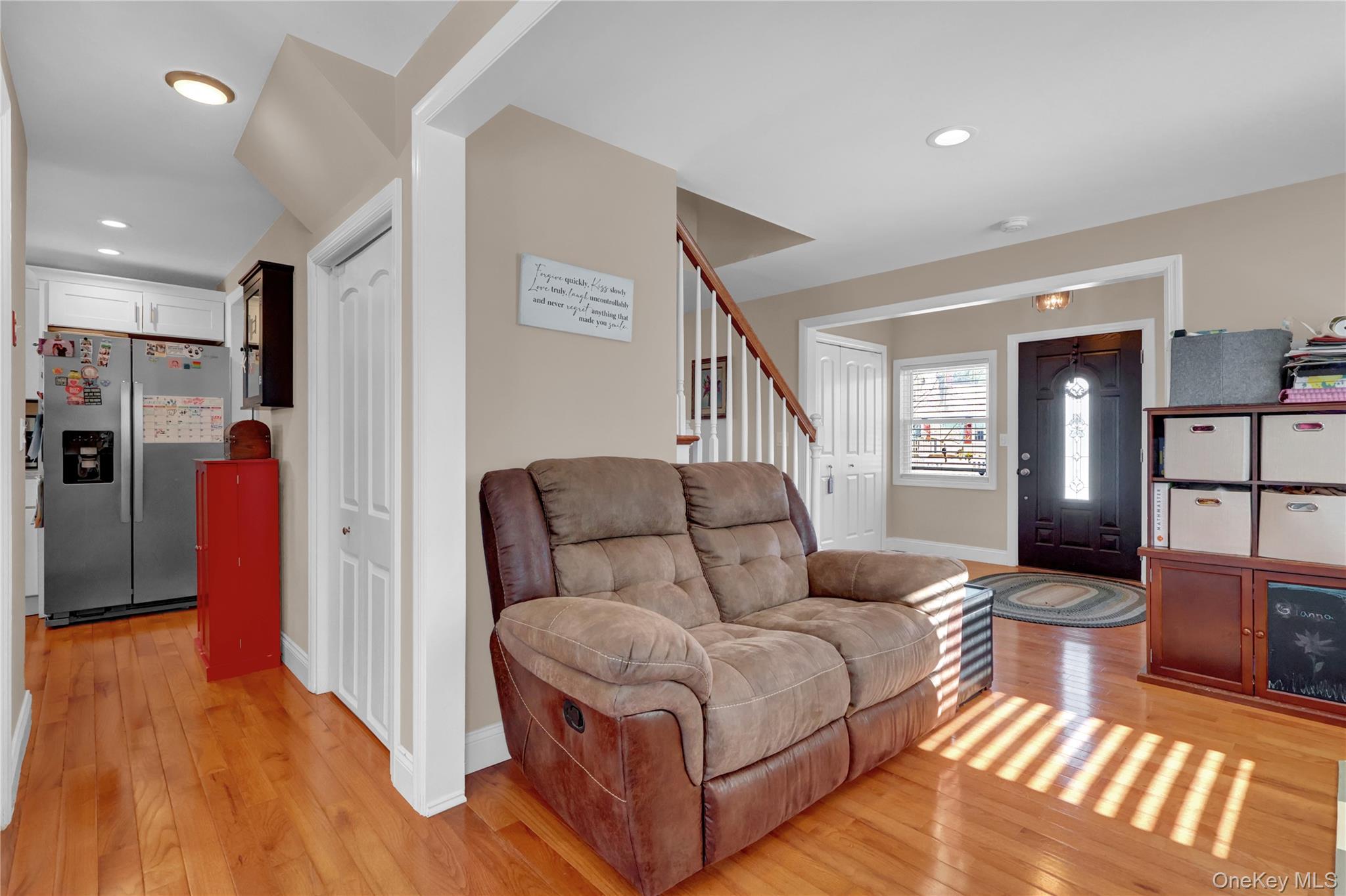 522 Browns Road Nesconset, NY 11767 - Photo 9 of 29 a living room with furniture and a wooden floor