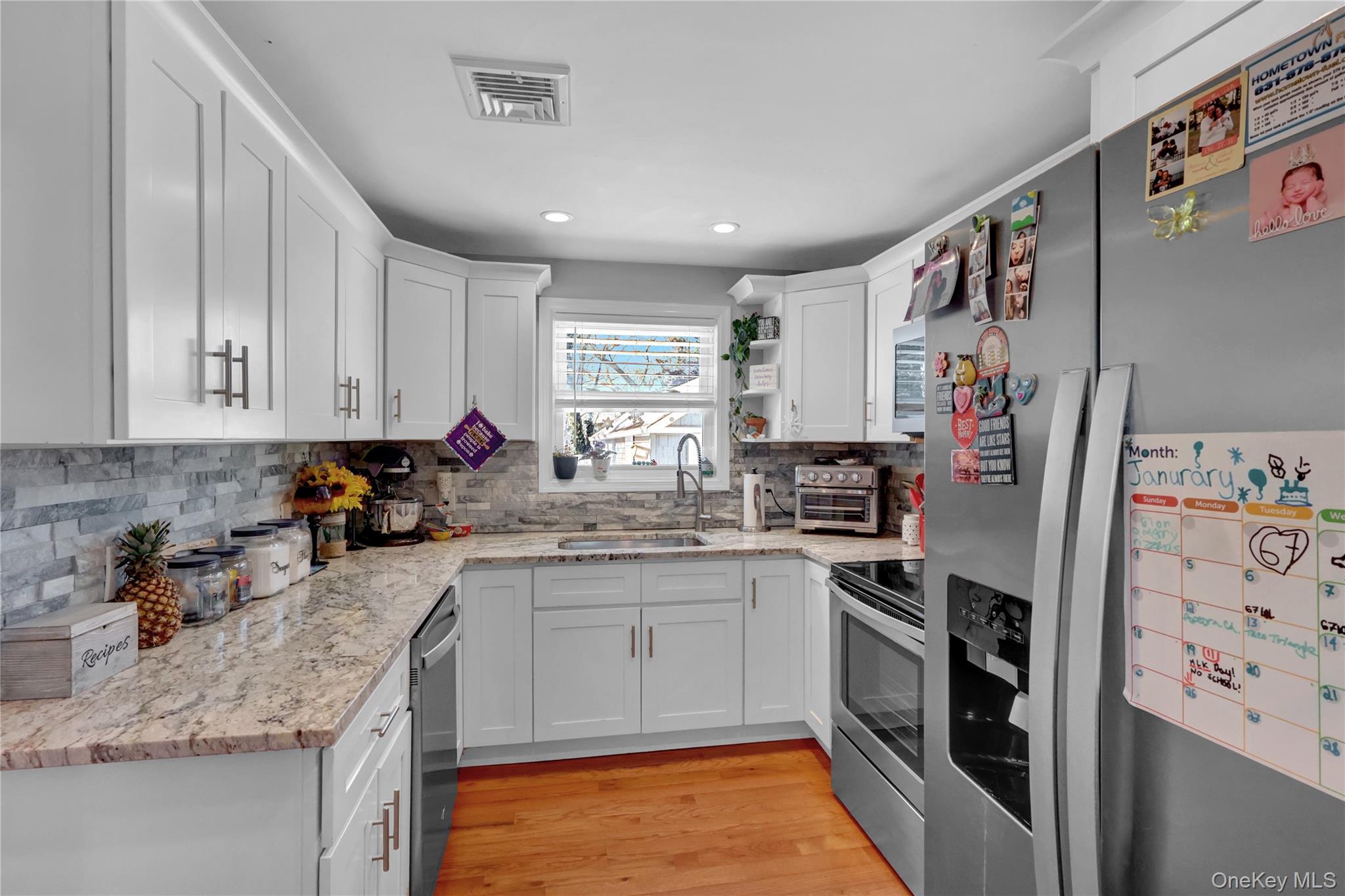 522 Browns Road Nesconset, NY 11767 - Photo 10 of 29 a kitchen with stainless steel appliances granite countertop a refrigerator sink and cabinets