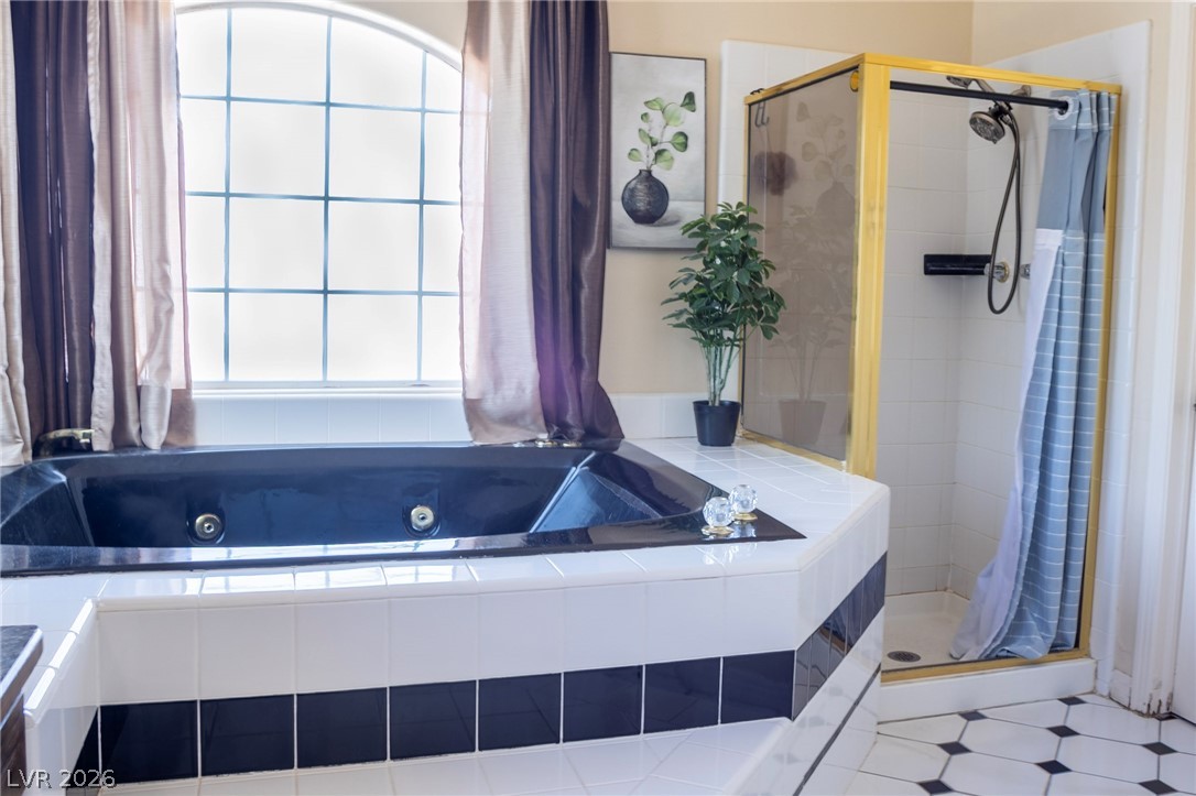 2775 Taylor Street Logandale, NV 89021 - Photo 9 of 41 Relax in this tranquil bathroom featuring a soaking tub and a dedicated shower area.