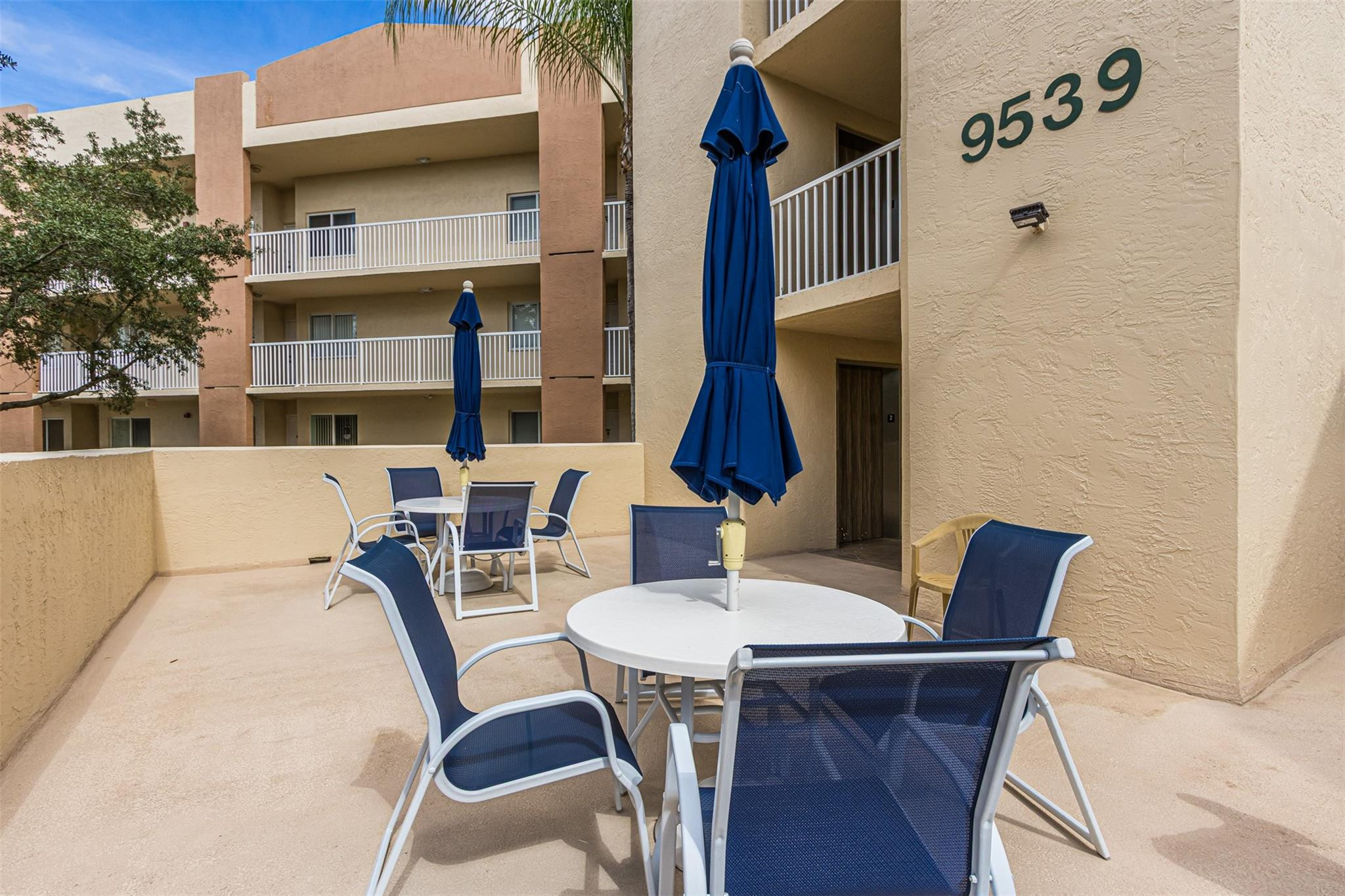 9539 Weldon Circle, Unit F201 Tamarac, FL 33321 - Photo 29 of 35 Weldon patio area in building