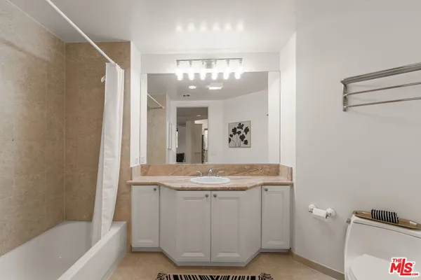 a view of kitchen with furniture and wooden floor