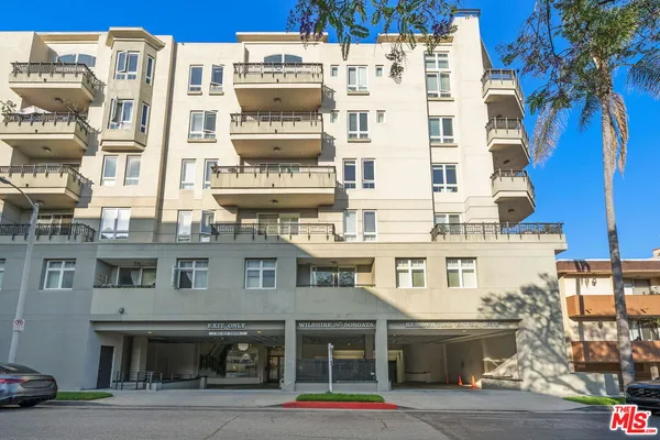a view of a street with a building in the background