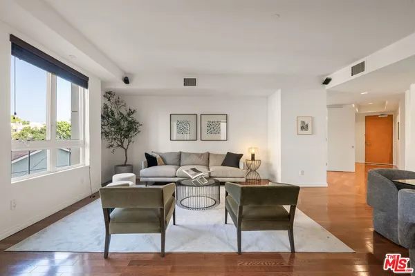 a living room with furniture and a table
