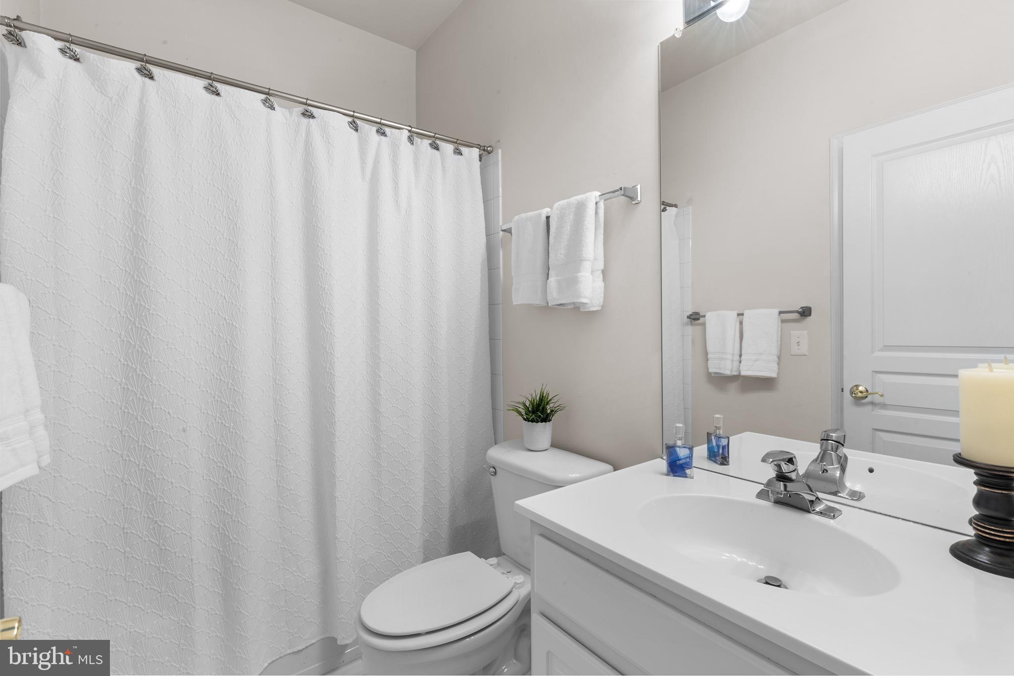 119 Violet Drive Kennett Square, PA 19348 - Photo 16 of 22 a bathroom with a sink a toilet and shower curtain