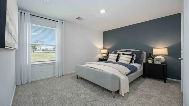 a bedroom with a bed and window