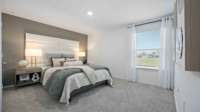 a bed room with a bed and a window