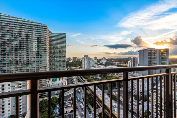a view of a balcony with furniture