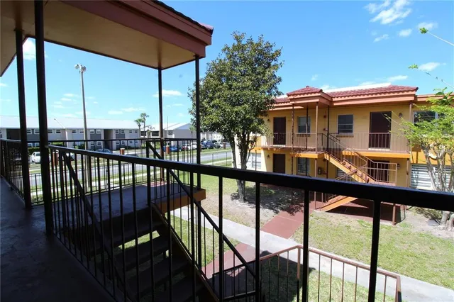 a view of a balcony with chairs
