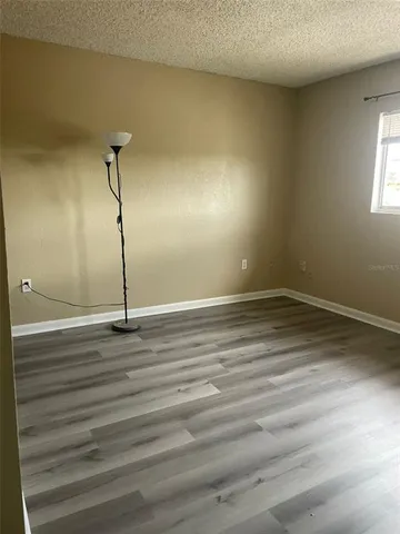 a view of a room with a wooden floor