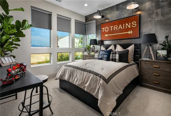 a bedroom with a bed and a window with the outer view