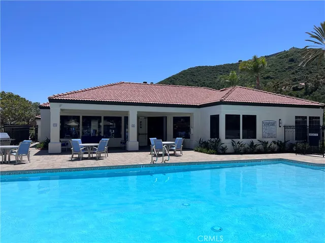 a front view of house with yard and seating space