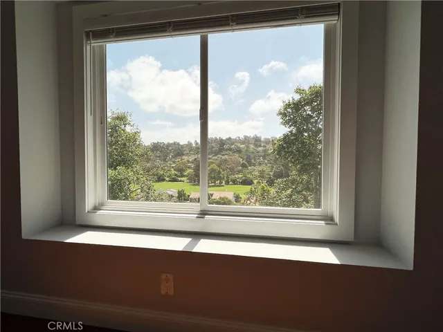 a view of a room that has a large window
