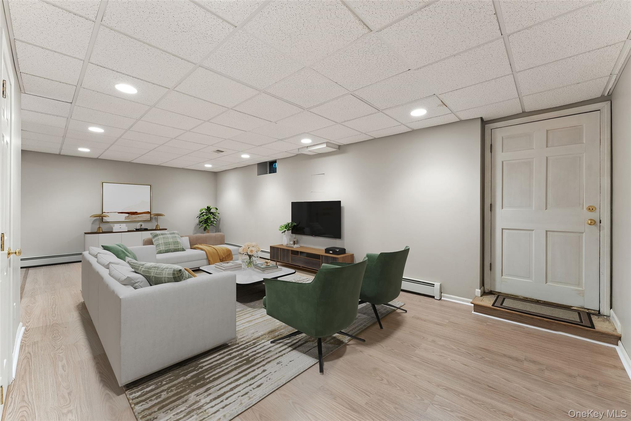 15 Sheldrake Road Scarsdale, NY 10583 - Photo 34 of 45 View of lower level recreation room virtually staged