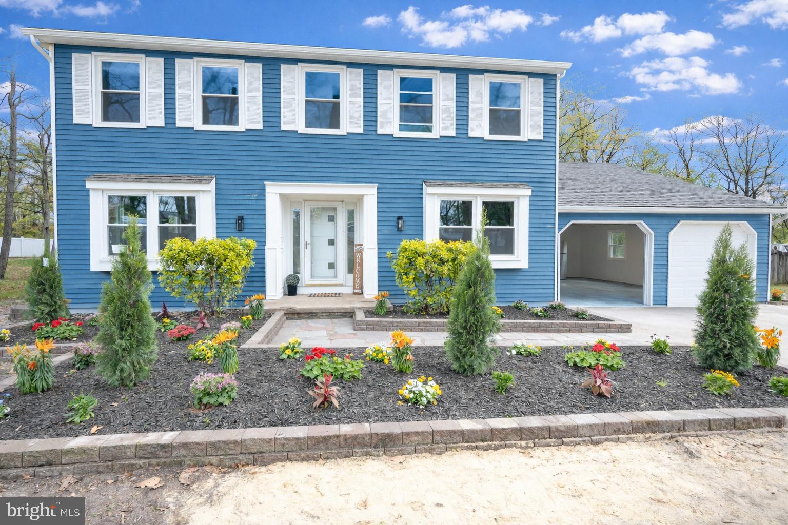 3 Slalom Court Pine Hill, NJ 08021 - Photo 2 of 47 a front view of a house with garden