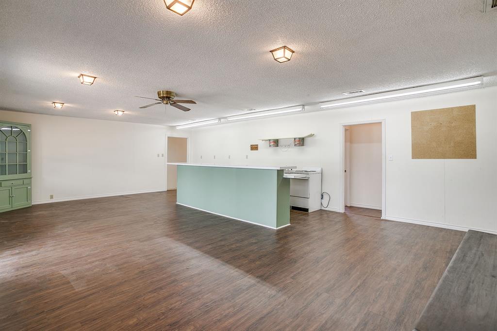 1048 Kennon Point Palo Pinto, TX 76484 - Photo 4 of 16 an empty room with wooden floor and windows