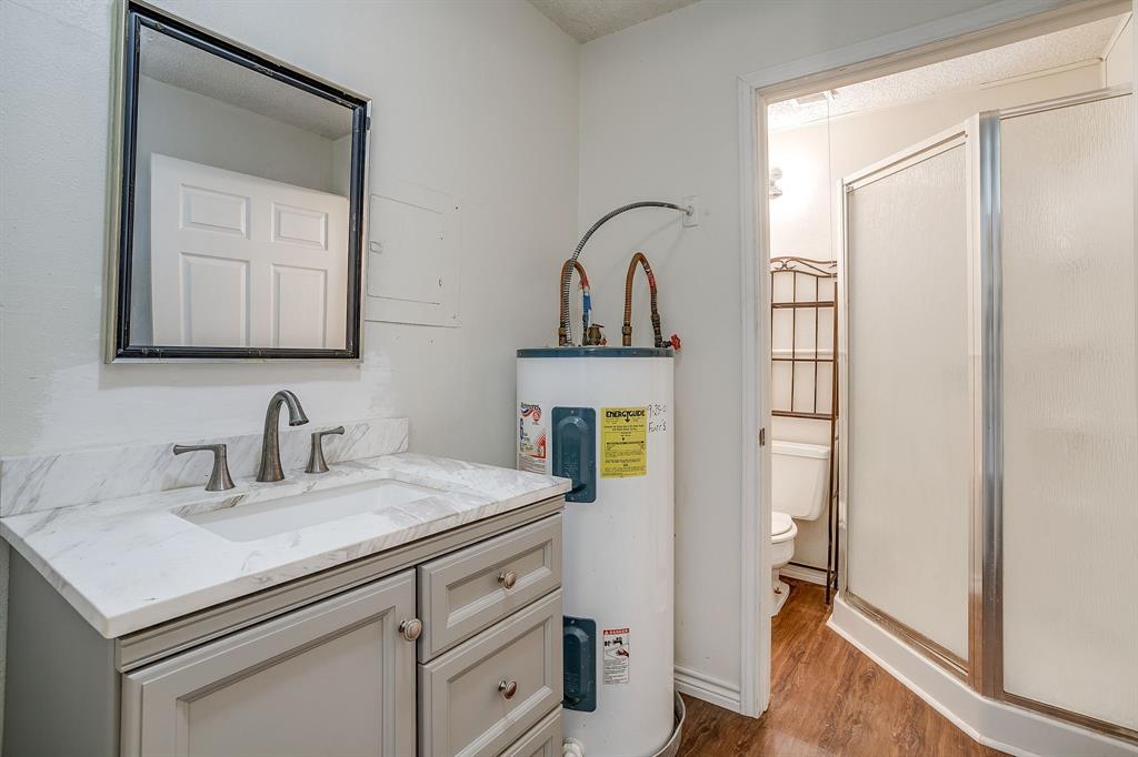 1048 Kennon Point Palo Pinto, TX 76484 - Photo 6 of 16 a bathroom with a sink and a mirror