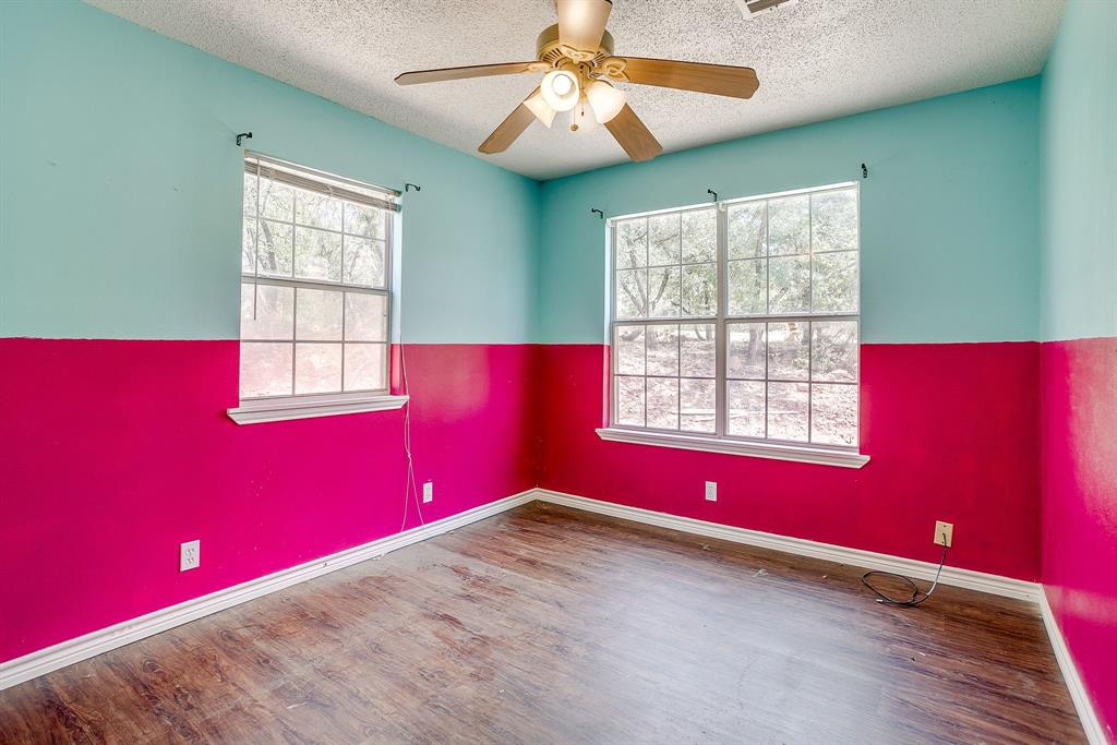 1048 Kennon Point Palo Pinto, TX 76484 - Photo 9 of 16 a view of empty room with chandelier fan and windows