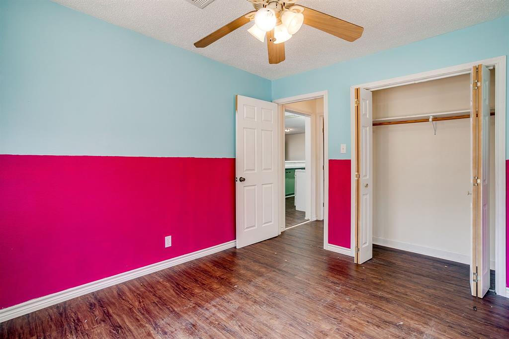 1048 Kennon Point Palo Pinto, TX 76484 - Photo 10 of 16 a view of a room with wooden floor and a ceiling fan