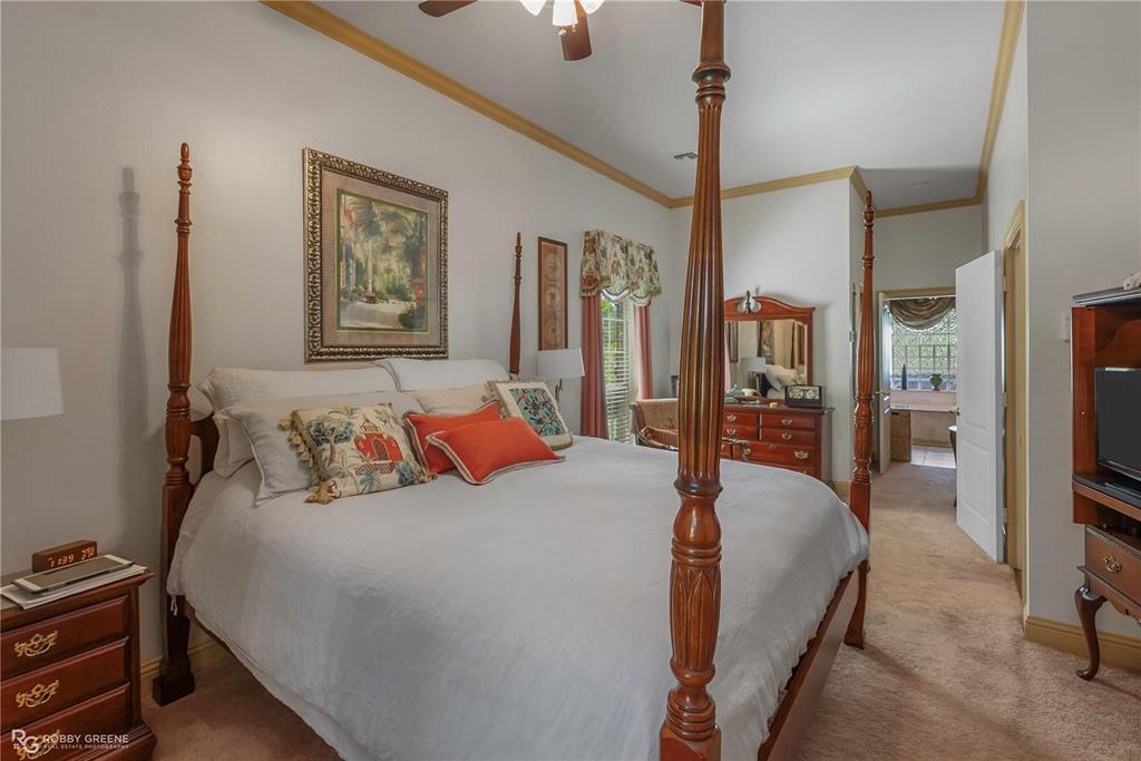 1171 Wemple Road Bossier City, LA 71111 - Photo 13 of 31 Bedroom with light carpet, ornamental molding, and ceiling fan