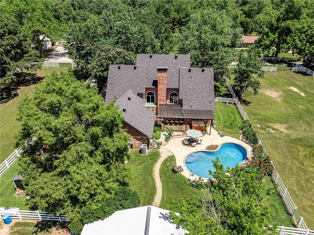 1171 Wemple Road Bossier City, LA 71111 - Photo 24 of 31 View of rural area featuring a pool