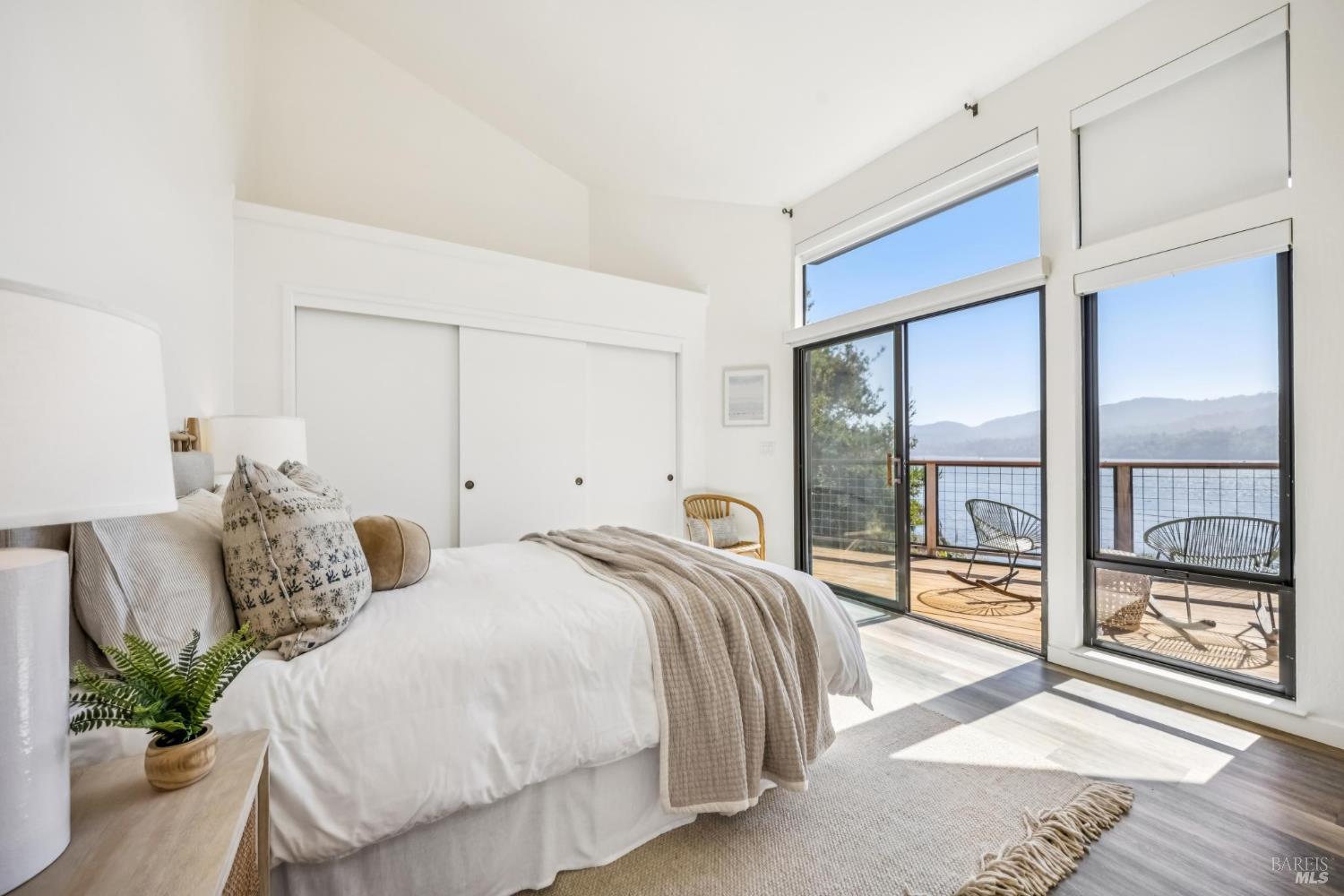 17523 Highway 1 Marshall, CA 94940 - Photo 21 of 72 a spacious bedroom with a bed and a large window