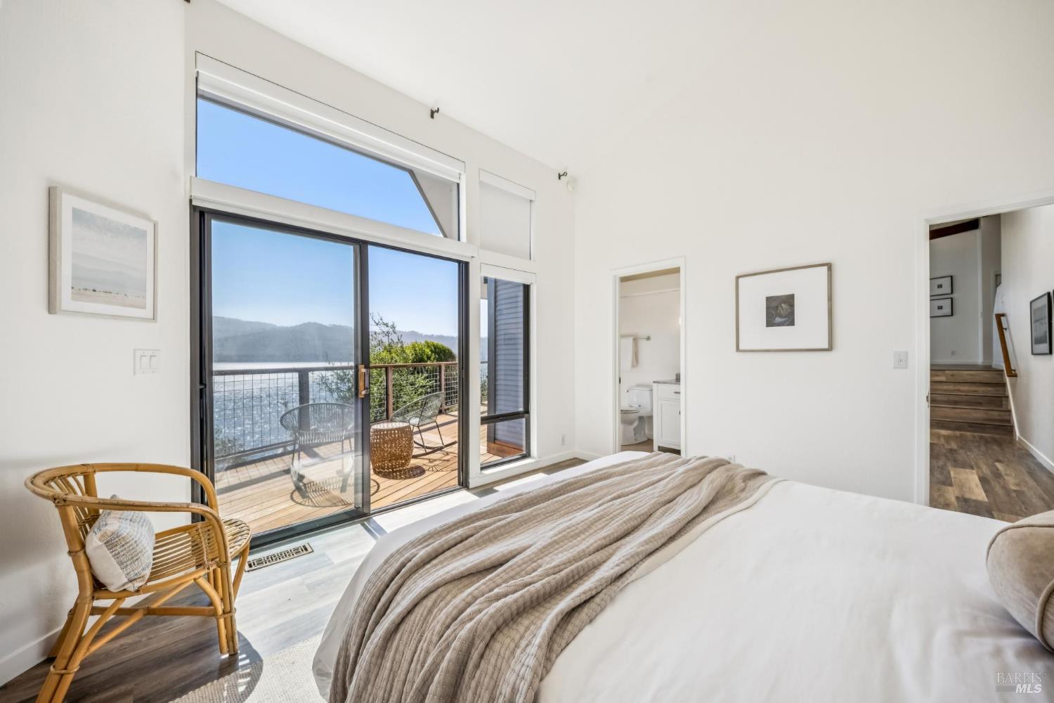 17523 Highway 1 Marshall, CA 94940 - Photo 22 of 72 a bedroom with a bed and glass door