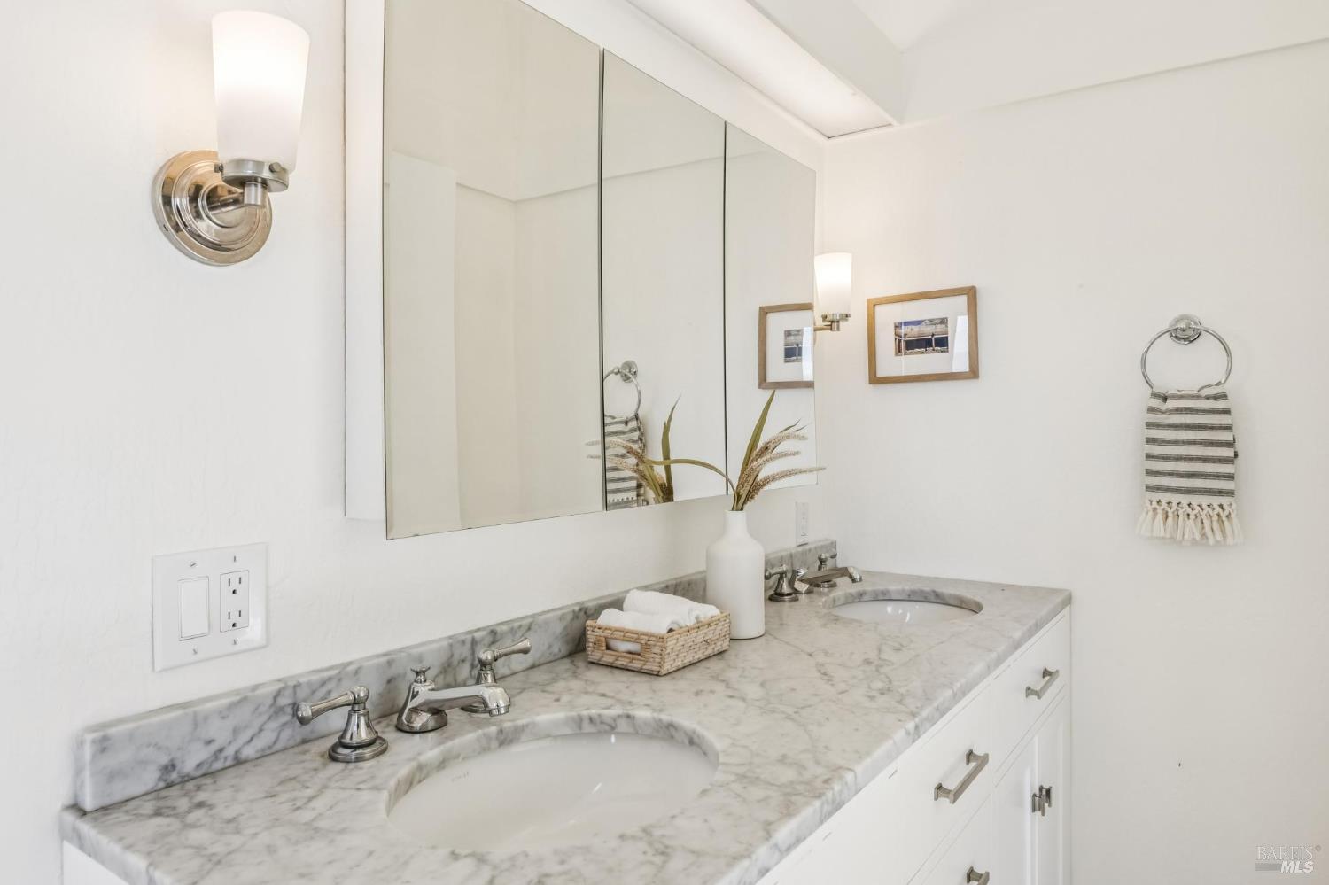 17523 Highway 1 Marshall, CA 94940 - Photo 23 of 72 a bathroom with a granite countertop sink and a mirror