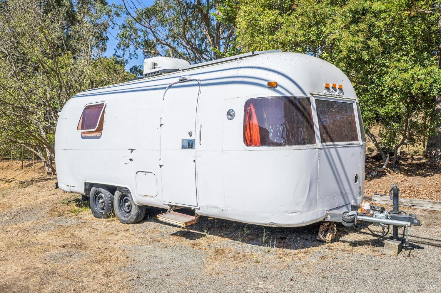 17523 Highway 1 Marshall, CA 94940 - Photo 54 of 72 a view of a white house with large trees