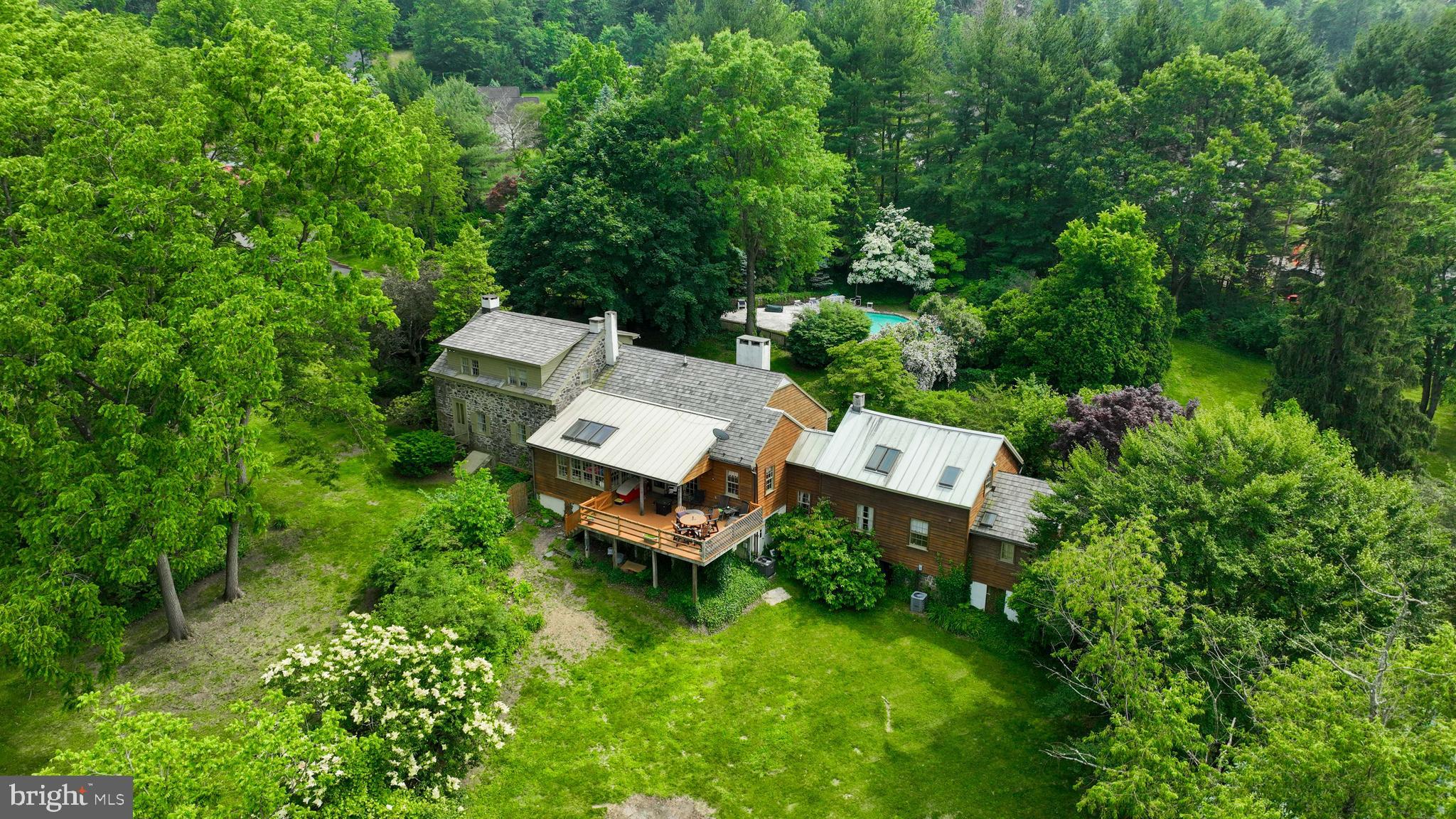 705 Schoffers Road Birdsboro, PA 19508 - Photo 11 of 106 a wooden bench sitting in the middle of a forest