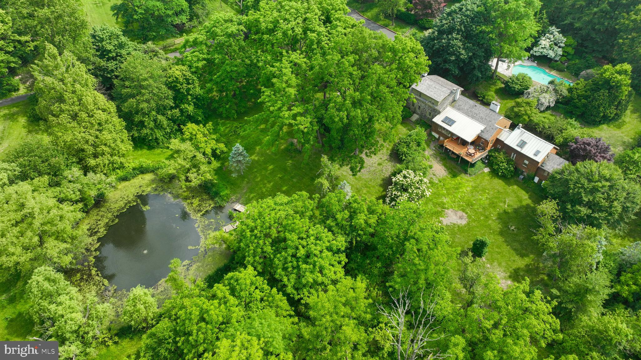 705 Schoffers Road Birdsboro, PA 19508 - Photo 3 of 106 an aerial view of a house with a yard and lake view