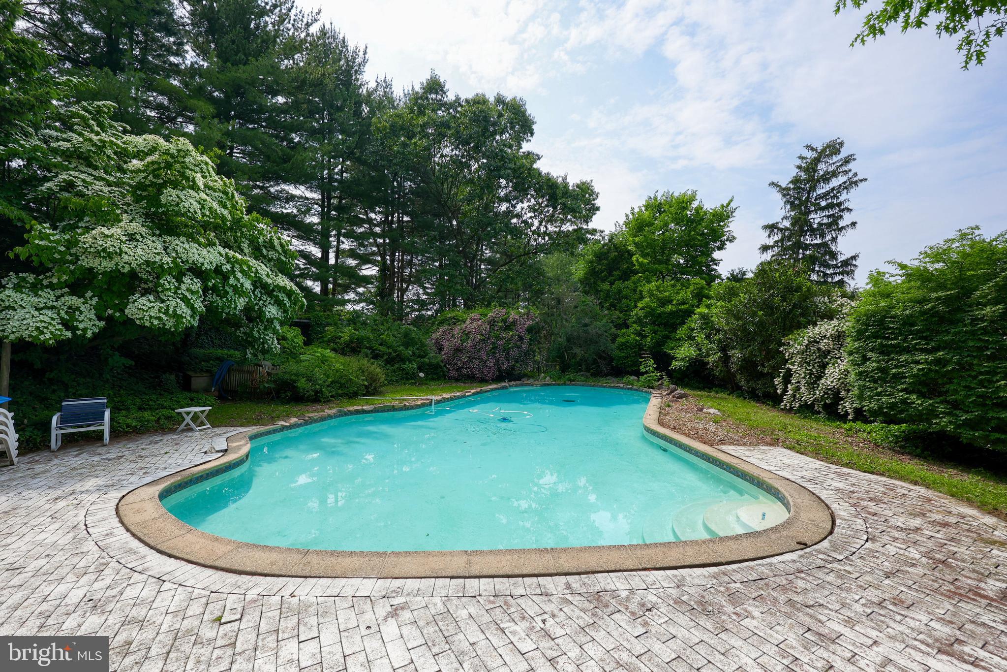 705 Schoffers Road Birdsboro, PA 19508 - Photo 39 of 106 a view of a swimming pool with a chairs