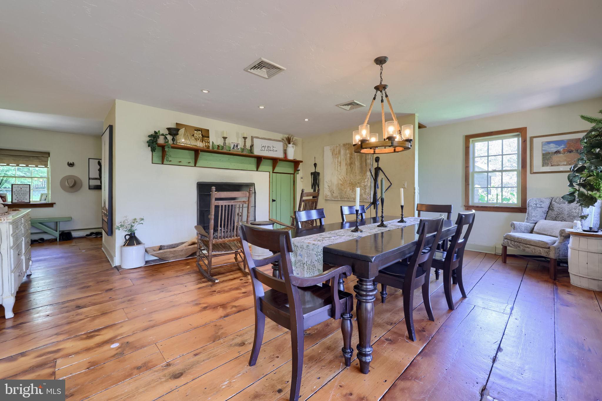 705 Schoffers Road Birdsboro, PA 19508 - Photo 46 of 106 a view of a dining room with furniture window and wooden floor